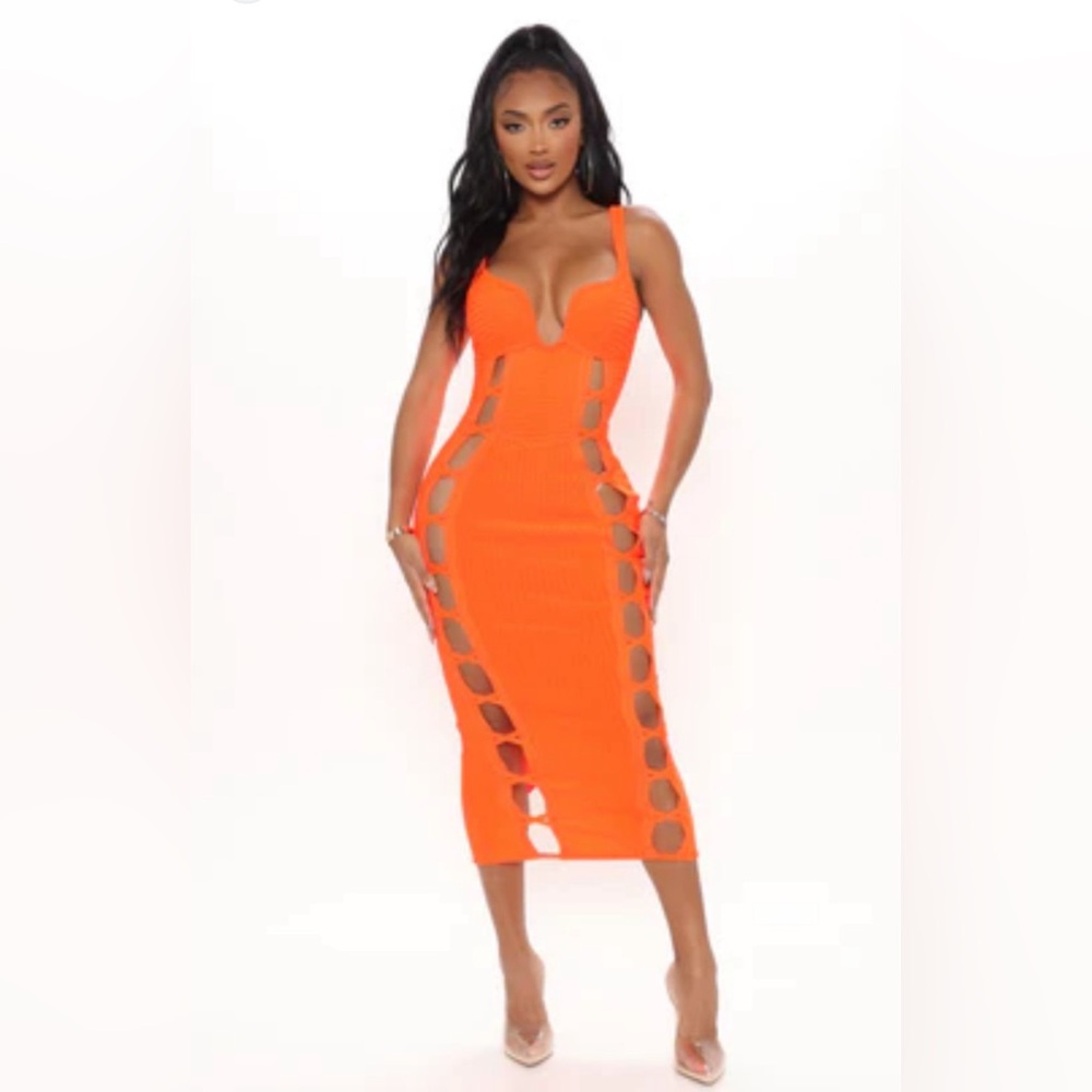 Sexy orange 🍊 dress size large. Cut outs on both sides. Midi